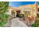 Inviting entryway with a landscaped walkway leading to the front door at 7015 N Jensen St, Las Vegas, NV 89149
