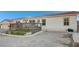 House with a deck, well-maintained landscaping, and a gravel driveway at 7015 N Jensen St, Las Vegas, NV 89149