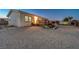Single story home with a deck and gravel driveway at 7015 N Jensen St, Las Vegas, NV 89149