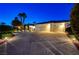 Three-car garage and well-lit driveway at this beautiful home at 7015 N Jensen St, Las Vegas, NV 89149
