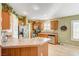 Kitchen with stainless steel appliances and wood cabinetry at 7015 N Jensen St, Las Vegas, NV 89149