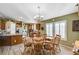 Kitchen boasts a large island, ample counter space, and a dining area at 7015 N Jensen St, Las Vegas, NV 89149