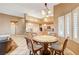 Kitchen with light wood cabinets, granite counters, and an island at 7015 N Jensen St, Las Vegas, NV 89149