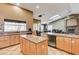 Spacious kitchen with island, ample cabinetry, and granite countertops at 7015 N Jensen St, Las Vegas, NV 89149