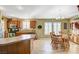 Kitchen features a breakfast nook, wood cabinets and tile floors at 7015 N Jensen St, Las Vegas, NV 89149