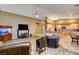 Living area with large TV, leather seating, and a built-in aquarium at 7015 N Jensen St, Las Vegas, NV 89149