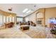 Spacious living room featuring a fireplace, large TV, and ample natural light at 7015 N Jensen St, Las Vegas, NV 89149