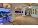 Covered patio with an outdoor kitchen and built-in stainless steel appliances at 7015 N Jensen St, Las Vegas, NV 89149