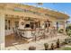 Outdoor patio with built-in BBQ, bar seating, and pergola at 7015 N Jensen St, Las Vegas, NV 89149