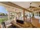 Relaxing patio area with seating, dining table, and pool view at 7015 N Jensen St, Las Vegas, NV 89149