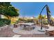 Patio with ping pong table, umbrella, and stone seating walls at 7015 N Jensen St, Las Vegas, NV 89149