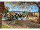 Private pool and pergola with lush landscaping and rock waterfall at 7015 N Jensen St, Las Vegas, NV 89149