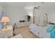 Light filled bedroom with tile floors, attached desk and a built-in wall unit at 8216 Wooden Windmill Ct, Las Vegas, NV 89131