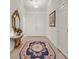 Elegant entry hall with ornate furniture and rug at 8216 Wooden Windmill Ct, Las Vegas, NV 89131