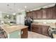 Kitchen with granite countertops and dark wood cabinets at 9217 Longhorn Falls Ct, Las Vegas, NV 89149