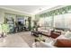 Bright living room with tiled floors and neutral colored furniture at 9217 Longhorn Falls Ct, Las Vegas, NV 89149