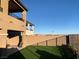 Landscaped backyard with artificial turf and a view of the mountains at 12381 Foxtail Run Ave, Las Vegas, NV 89138