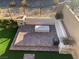 Elevated view of backyard patio with brick pavers, seating, and fire pit at 12381 Foxtail Run Ave, Las Vegas, NV 89138