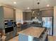 Modern kitchen with stainless steel appliances and granite countertops at 12381 Foxtail Run Ave, Las Vegas, NV 89138