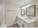 Elegant bathroom with double vanity and marble shower at 1408 Palm St, Henderson, NV 89011