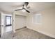 Bedroom with grey carpet, ceiling fan, closet, and access to another room at 1408 Palm St, Henderson, NV 89011