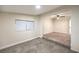 Bedroom with grey carpet, ceiling fan, and window at 1408 Palm St, Henderson, NV 89011