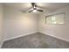 Bright bedroom with ceiling fan and grey carpet at 1408 Palm St, Henderson, NV 89011