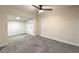 Well-lit bedroom with grey carpeting and ceiling fan at 1408 Palm St, Henderson, NV 89011