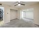 Bedroom with grey carpet, ceiling fan, and ample closet space at 1408 Palm St, Henderson, NV 89011