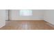 Simple living room featuring tile floors and a window at 1420 Arlington Heights St, Las Vegas, NV 89110