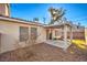 Home's backyard features a covered patio and gravel at 1473 Teddington Ct # 101, Las Vegas, NV 89102