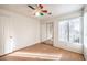 Bedroom with wood flooring, ceiling fan and mirrored closet at 1473 Teddington Ct # 101, Las Vegas, NV 89102