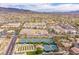 Extensive aerial shot of community, pickleball and tennis courts and the desert mountain terrain at 1510 Fieldbrook St, Henderson, NV 89052
