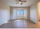 Bright bedroom with modern flooring, a ceiling fan, and a bay window offering natural light at 1510 Fieldbrook St, Henderson, NV 89052