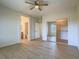 Open bedroom featuring hard surface floors, an ensuite bathroom, and a closet with mirrored doors at 1510 Fieldbrook St, Henderson, NV 89052