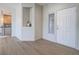 Bright entryway with wood-look floors and view into the kitchen area at 1510 Fieldbrook St, Henderson, NV 89052