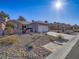 Single-story house with a two-car garage and desert landscaping at 1510 Fieldbrook St, Henderson, NV 89052