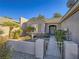 Landscaped front yard with walkway to entryway and gated access at 1510 Fieldbrook St, Henderson, NV 89052