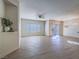 Spacious living room with sleek flooring, modern fixtures, and a sliding glass door to the outdoors at 1510 Fieldbrook St, Henderson, NV 89052