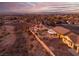 Elevated view of a house with a backyard and scenic landscape at 1645 Warrington Dr, Henderson, NV 89052