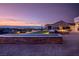 Stunning backyard at sunset with fire pit and city views at 1645 Warrington Dr, Henderson, NV 89052