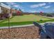 Landscaped backyard putting green with decorative turtle at 1645 Warrington Dr, Henderson, NV 89052