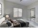 Virtually staged bedroom with mirrored closet doors at 1656 Black Fox Canyon Rd, Henderson, NV 89052