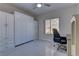 Bedroom with a built-in wall bed and home office space at 1656 Black Fox Canyon Rd, Henderson, NV 89052