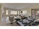 Bright dining area with a large table and access to the living room at 1656 Black Fox Canyon Rd, Henderson, NV 89052