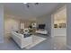 Open living room with a view into the kitchen and dining area at 1656 Black Fox Canyon Rd, Henderson, NV 89052