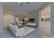 Virtually staged living room with open concept floor plan at 1656 Black Fox Canyon Rd, Henderson, NV 89052