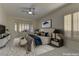 Virtually staged main bedroom with large window and neutral tones at 1656 Black Fox Canyon Rd, Henderson, NV 89052