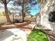 Landscaped patio with seating area and brick steps at 1813 Francisco Peak Pl, Las Vegas, NV 89128