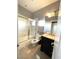 Modern bathroom with a walk-in shower and granite vanity at 1813 Francisco Peak Pl, Las Vegas, NV 89128